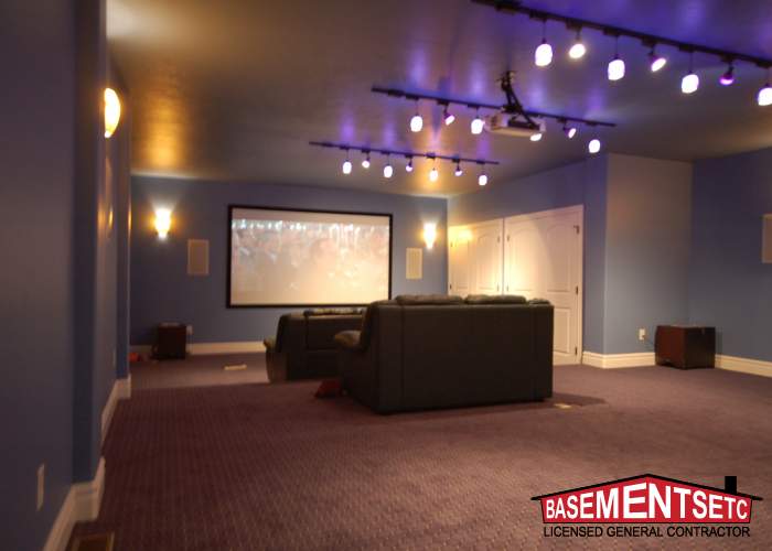 Finished basement living room in Bluffdale, Utah showing custom lighting and modern flooring.