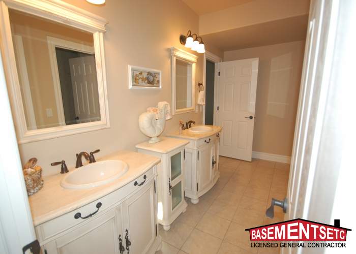 Elegant luxury bathroom with double sinks and light-colored cabinetry