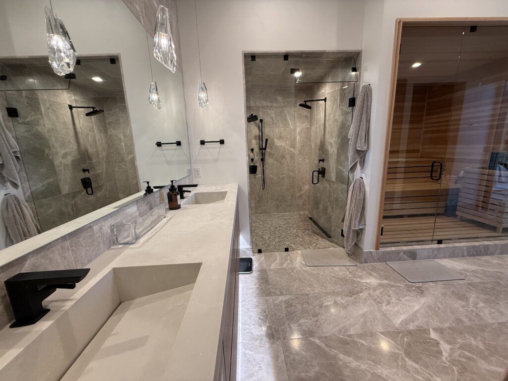 Modern bathroom with dual sinks, glass shower, and sauna.
